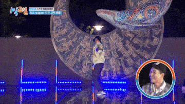 a man stands on a stage in front of a sculpture with the words no respect on it