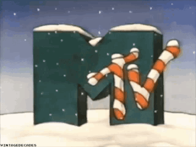 the mtv logo is covered in candy canes and snow .