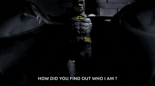 a man in a batman costume asking how did you find out who i am