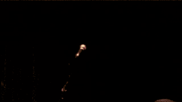 a close up of a person holding a fireball