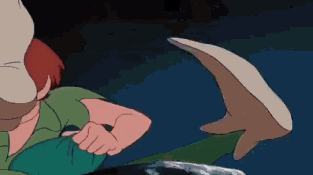 a close up of a cartoon character 's foot with a dark background