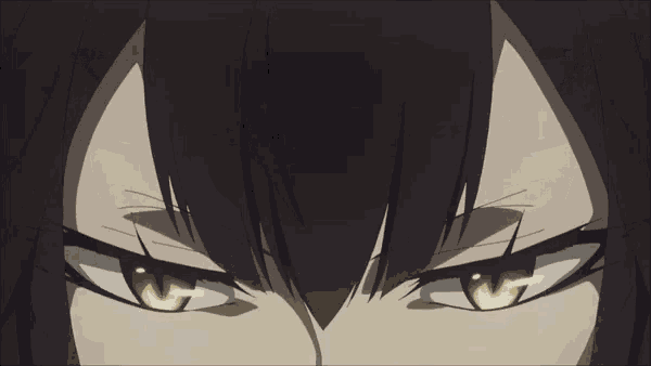 a close up of a woman 's face with a smirk on her face