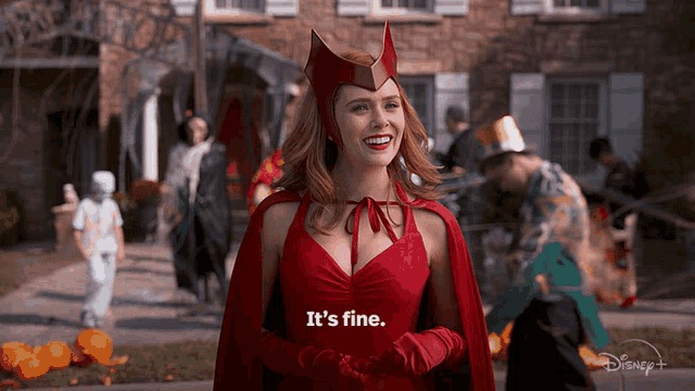 a woman in a scarlet witch costume is smiling and says it 's fine