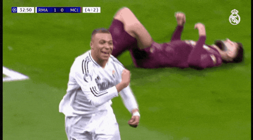 a soccer player wearing an emirates fly better jersey is running on the field