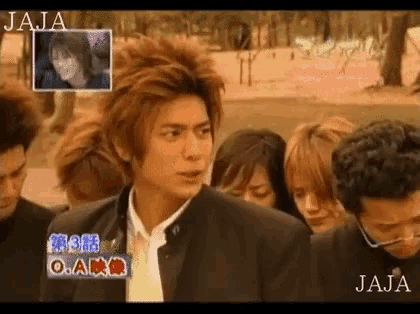 a group of people are standing in a line with jaja written on the bottom