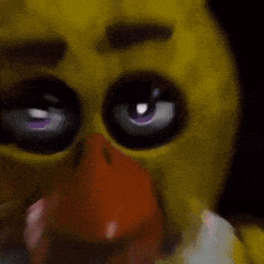 a close up of chica from five nights at freddy 's with purple eyes and a yellow face .