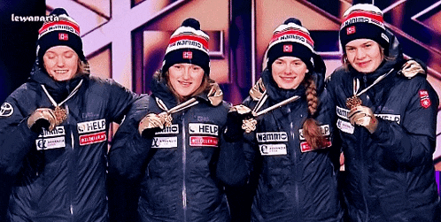 a group of female athletes wearing jackets that say help