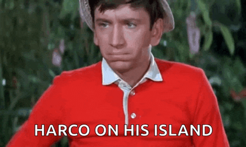 a man in a red shirt and hat is making a funny face and says harco on his island .