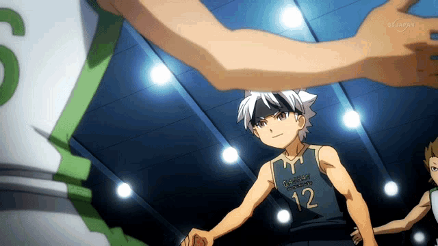 a basketball player with the number 12 on his jersey holds hands with another player