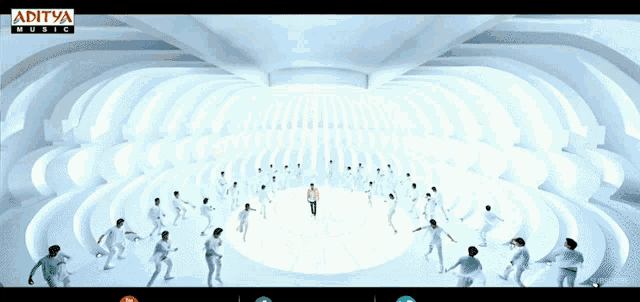 an ad for aditya music shows a group of people dancing in a white room