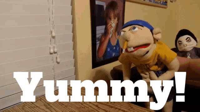 a puppet with the word yummy written on it