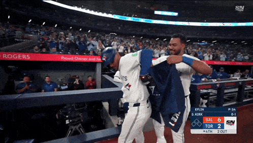two blue jays baseball players are getting ready to play a game