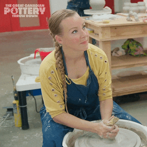 a woman is sitting on a pottery wheel with the great canadian pottery throw down written on the bottom