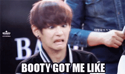 a young man is making a funny face with the words booty got me like written below him .