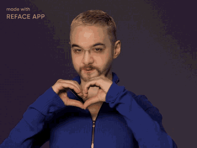 a man in a blue jacket making a heart shape with his hands made with reface app