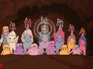 a group of cartoon ponies are standing next to each other in a line .