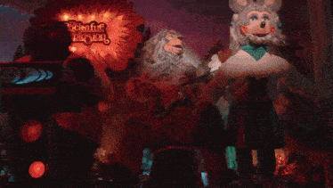 a statue of a bearded man is playing a guitar in front of a sign that says rockabilly delight