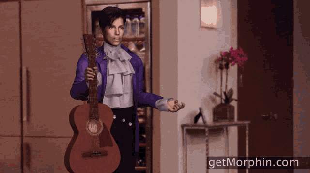 a man in a purple jacket is holding a guitar with the website getmorphin.com below him