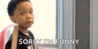 a young boy is standing in front of a window holding a bat and saying `` sorry i 'm funny '' .