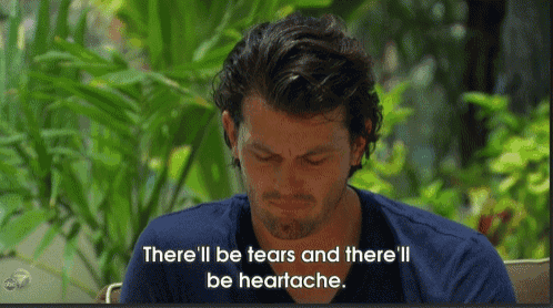 a man in a blue shirt is crying with the words " there 'll be tears and there 'll be heartache " below him