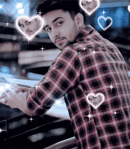 a man in a plaid shirt has hearts around his face