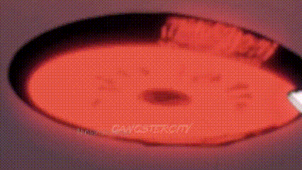 a close up of a person 's eye with a red pupil and a white pupil .