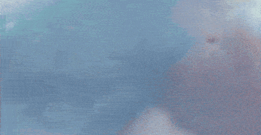 a group of young men are dancing in a room with clouds coming out of the ceiling