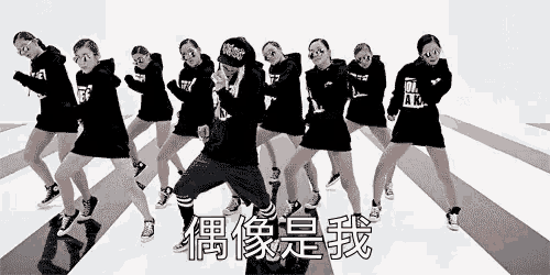 a group of people are dancing in a black and white photo with chinese writing on the bottom .