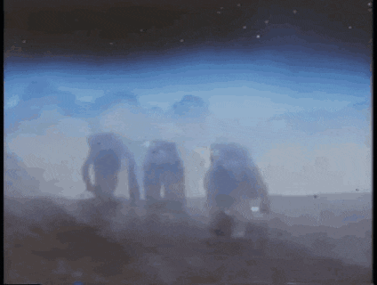 a blurry picture of a group of people standing in a foggy field