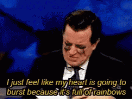 a man in a suit and tie is crying with tears coming out of his eyes