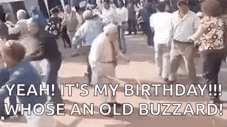 a group of people are dancing in a crowd and one of them is an old man .