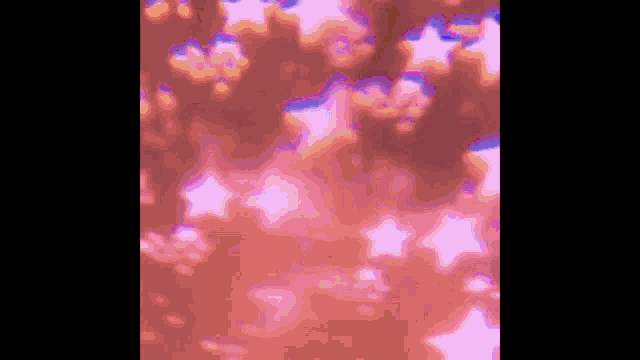 a blurred image of a pink background with stars
