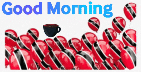 a cup of coffee sits in front of a bunch of red and black balloons with the words good morning
