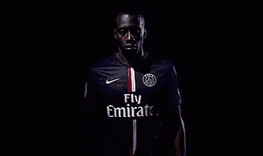 a soccer player is wearing a fly emirates shirt