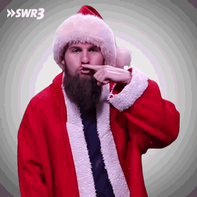 a man with a beard is wearing a santa suit and hat with swr3 on the bottom right