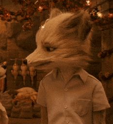 a stuffed animal with a fox 's head on it