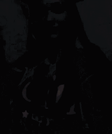 a woman is wearing a black shirt that says oil on it