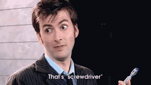 a man in a suit and tie is holding a screwdriver and saying that 's screwdriver .