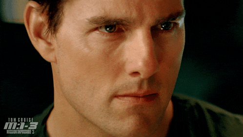a close up of a man 's face with the words tom cruise mission impossible 3 behind him