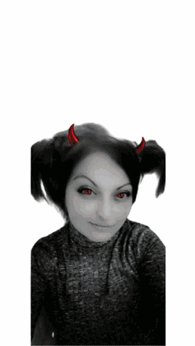 a woman with red eyes and devil horns on her hair