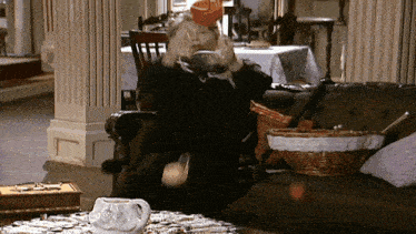a woman sitting in a chair with a bowl on her head that says ' coca-cola ' on it