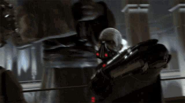 a robot with red lights on it 's arm