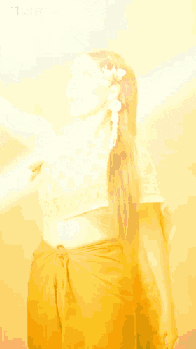 a woman is wearing a crop top and a brown skirt with the word thailand on the bottom right