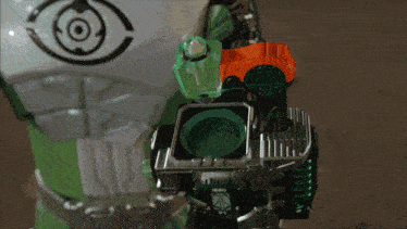 a person is holding a device with a green light coming out of the top
