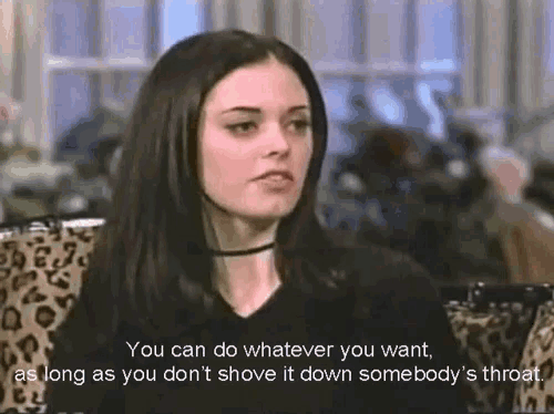 a woman is sitting in a chair with a leopard print couch and says you can do whatever you want .