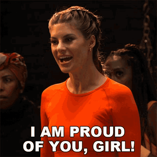a woman in an orange shirt says " i am proud of you, girl "