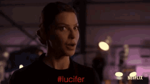 a close up of a woman 's face with the word lucifer written on it .