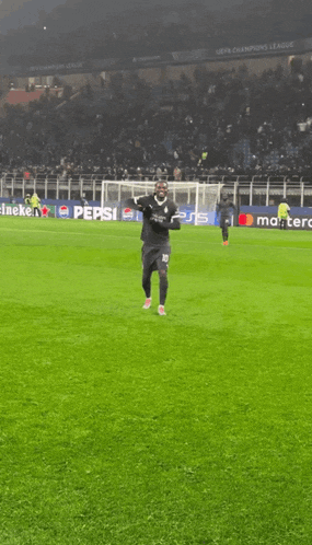 a soccer player with the number 10 on his jersey is dancing on the field