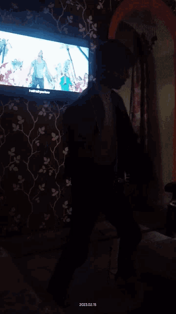 a man is dancing in front of a tv that says youtube on the screen