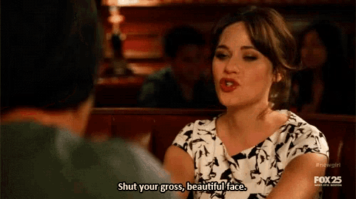 a woman is sitting at a table talking to a man and says shut your gross , beautiful face .